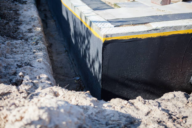 Professional Waterproofing technician working in Macomb, IL